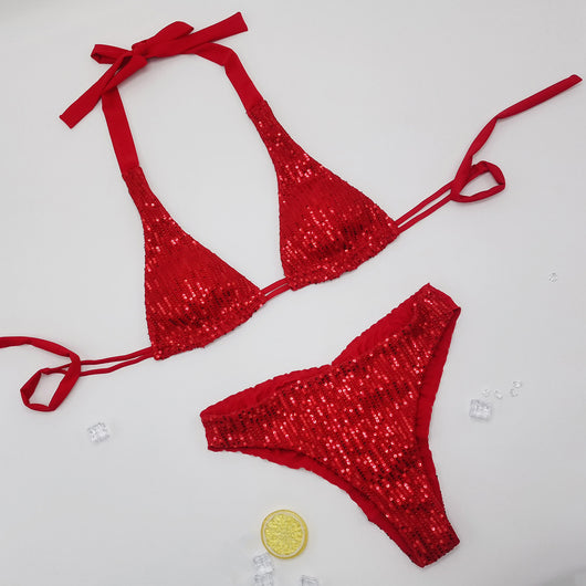 Pink and yellow sequined halter bikini top and high-cut bottoms on a model against a clear blue sky. - Image 13