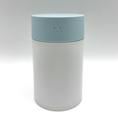 M Style mini humidifier with a light blue top and translucent white body, suitable for bedroom or office. - Image 3