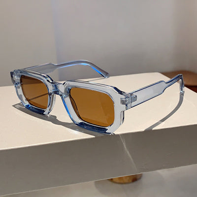 Black square-frame sunglasses with thick, angular frames and dark blue lenses, shown on a white background. - Image 31
