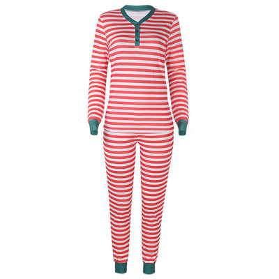 Family of four wearing matching red and white striped Christmas pajamas with green cuffs. One child wears a Santa hat, another wears reindeer antlers. - Image 16