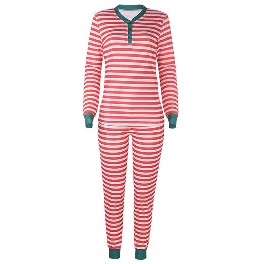 Family of four wearing matching red and white striped Christmas pajamas with green cuffs. One child wears a Santa hat, another wears reindeer antlers. - Image 16