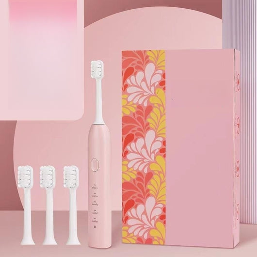 Light blue electric toothbrush with four soft bristle brush heads and a decorative box with teal leaf pattern. - Image 10