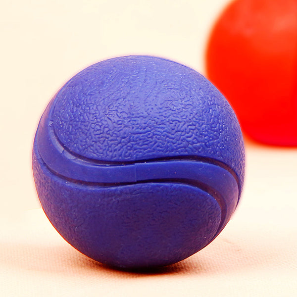 Red rubber pet toy ball with a textured surface and grooves, measuring 6.5cm in diameter.