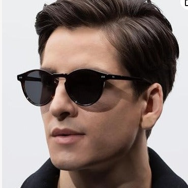 Round black full-rim sunglasses with vibrant blue polarized lenses, ideal for sun protection and fashion. - Image 3