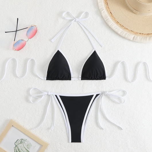 Royal blue two-piece bikini with light blue trim and tie straps, laid flat on a white textured surface. - Image 8