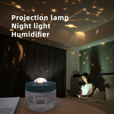 White portable projection humidifier with a translucent water tank and gold-accented control buttons. - Image 7