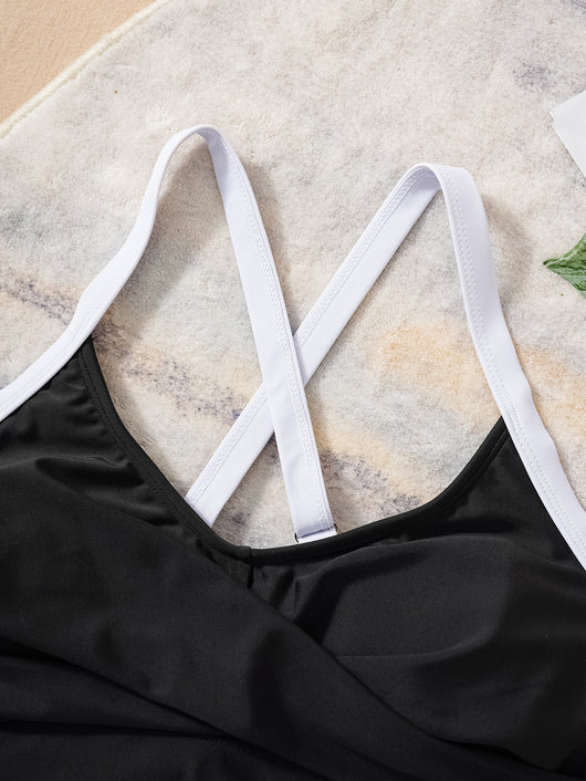 Black and white color matching bikini swimsuit with a high-waisted drawstring bottom and a split top. - Image 10