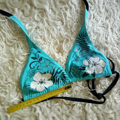 Black halter bikini suit with boy short bottoms, featuring pink and blue floral and flamingo patterns. - Image 4