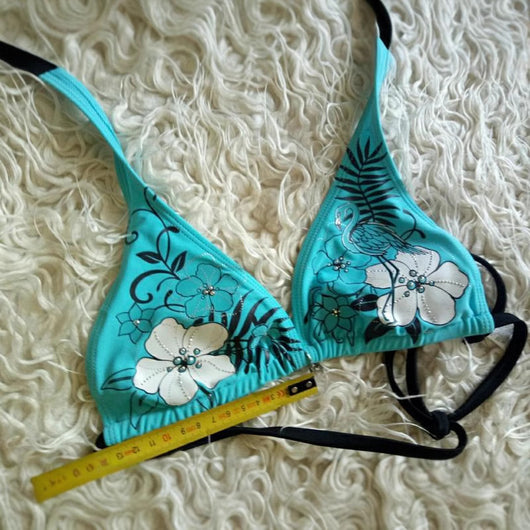 Black halter bikini suit with boy short bottoms, featuring pink and blue floral and flamingo patterns. - Image 4
