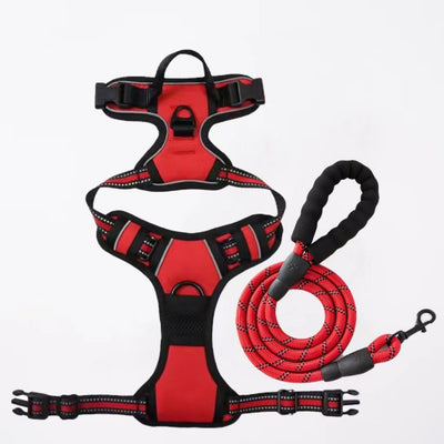 Red and black dog harness with reflective strips, adjustable straps, and a top handle for secure pet control. - Image 15