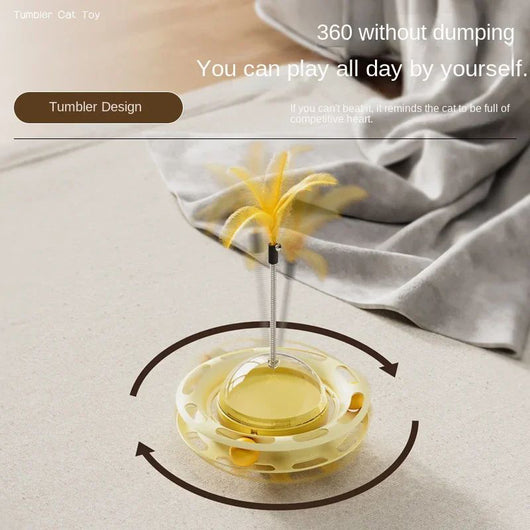 Yellow UFO tumbler cat toy with rolling balls, a clear dome, and a spring-mounted feather wand with a bell. - Image 7