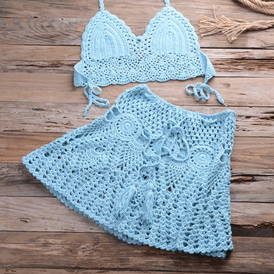 Light beige crochet bikini set with a halter crop top and a matching open-knit mini skirt with tassels. - Image 35