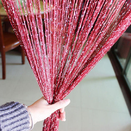 Hand holding a section of a silver shimmering string curtain with sparkling threads, ideal for door or room partition. - Image 7