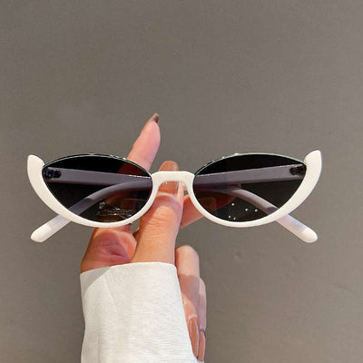 Pink cat-eye sunglasses with purple gradient lenses on a white background, showcasing a trendy style. - Image 3