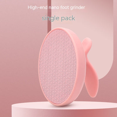 Pink oval nano foot grinder with a textured surface and ergonomic handle, designed for exfoliating and removing calluses. - Image 2