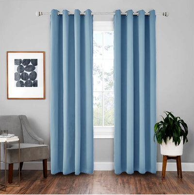 Light gray polyester blackout curtains with grommet tops hanging on a white rod in a modern living room. - Image 12