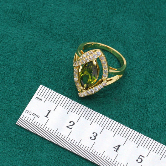 Gold-toned jewelry set with green marquise gemstones and clear accents, including a bracelet, necklace, earrings, and ring. - Image 10