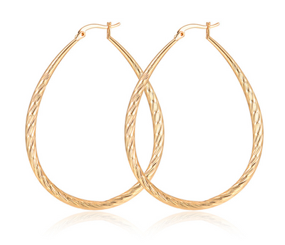 Aretes Dorados en Gota con Textura y Acabado Mate - Image 7