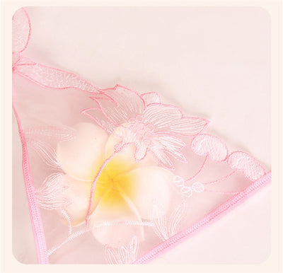 Light pink sheer lace bralette and thong set with delicate floral embroidery, modeled on a mannequin. - Image 11