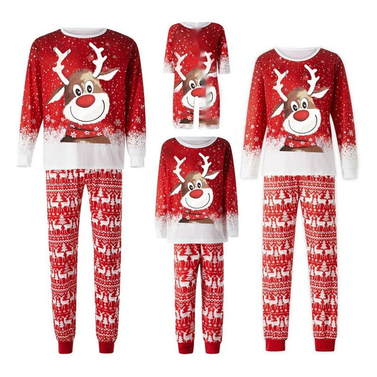 Family of four wearing matching red Christmas pajamas with reindeer and snowflake patterns and red pom-pom beanies. - Image 12