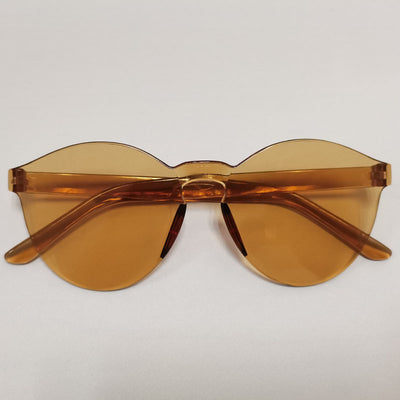 Trendy one-piece candy-colored sunglasses with dark gray lenses and a unique wavy top edge. - Image 2