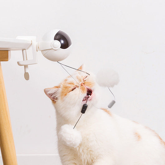 Pink automatic lifting cat toy with a black visor-like front, a clamp, and a white fluffy ball on a string. - Image 12