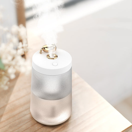 Cute cat-themed USB desktop humidifier with a pink top and base, frosted clear body, and gold cat ear accent. - Image 11