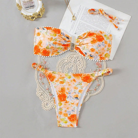 Orange floral print bandeau bikini with pom-pom trim and high-cut thong bottom with side rings. - Image 12