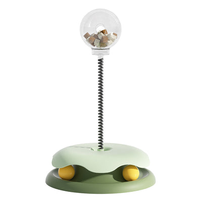 Mint green and dark green cat leakage food toy with a clear spherical treat dispenser on a black spring. - Image 7