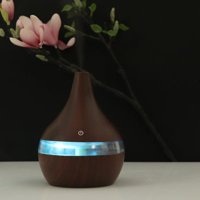 Dark wood grain USB mini tip air purifier and humidifier with a teardrop shape and a silver band. - Image 12
