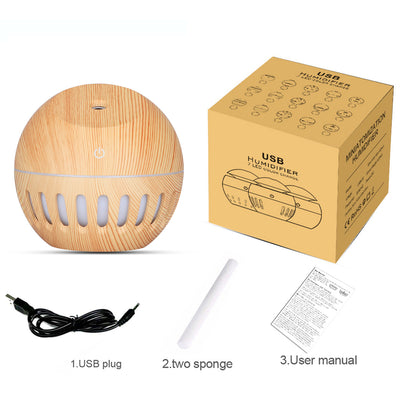 White portable home office humidifier with a spherical base, dome top, and glowing blue LED light accents. - Image 6