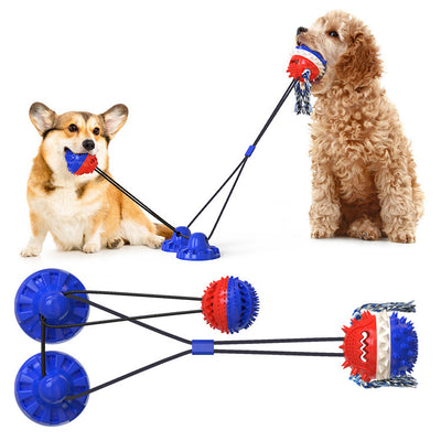 Red, white, and blue textured dog chew toy with rope tassels and a blue suction cup base, shown with a Dalmatian puppy playing. - Image 27