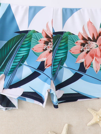Woman in a three-piece bikini swimsuit set with a black tube top, floral boy shorts, and a sheer floral kimono cover-up. - Image 23