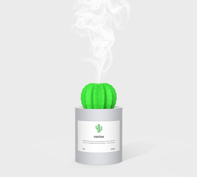 Person holding a glowing white cactus humidifier with a green top; inset shows five white humidifier filter sticks. - Image 4