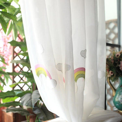 White sheer gauze curtain with colorful embroidered rainbows and grey clouds, suitable for a child's room. - Image 4