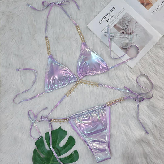 Iridescent purple and pink two-piece bikini with gold-toned crystal embellishments on a white faux fur background. - Image 9