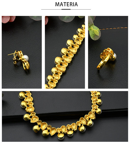 Women's four-piece jewelry set with matte gold teardrop links and white pearls, including a necklace, earrings, ring, and bracelet. - Image 7