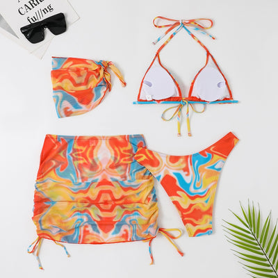 Four-piece tie-dyed bikini swimsuit set in orange, yellow, and white, with a triangle top, high-cut bottoms, ruched mini skirt, and matching headscarf. - Image 15