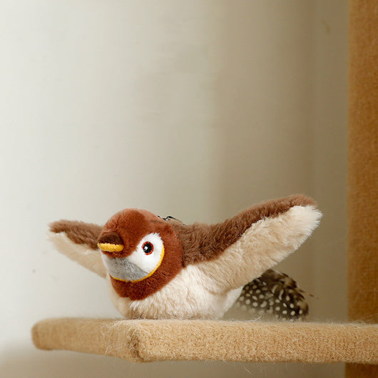 Plush woodpecker pet toy with a red crest, black and white body, speckled gray wings, and black tail feathers.