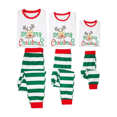 Family of four wearing matching white and green striped Christmas pajamas with reindeer and "Merry Christmas" text. - Image 13