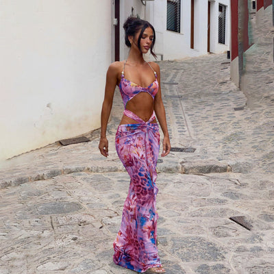 Women's two-piece swimsuit with a halter bikini top and a matching long skirt, featuring a vibrant tropical and animal print. - Image 3