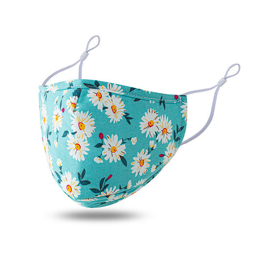 Teal cotton face mask with white floral pattern and brown leaves, featuring adjustable white ear loops. - Image 7