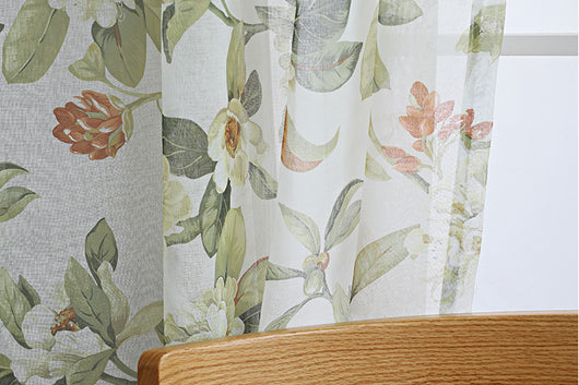 Dark gray semi-sheer curtains with a white and green floral pattern, hung on a black rod in a living room. - Image 21