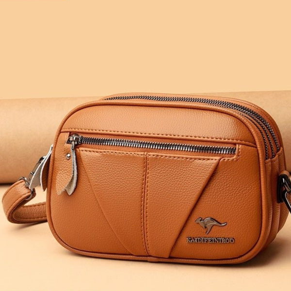 Bolso Bandolera Redondo de Cuero Genuino - Versátil y Elegante