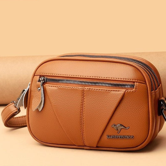 Bolso Bandolera Redondo de Cuero Genuino - Versátil y Elegante