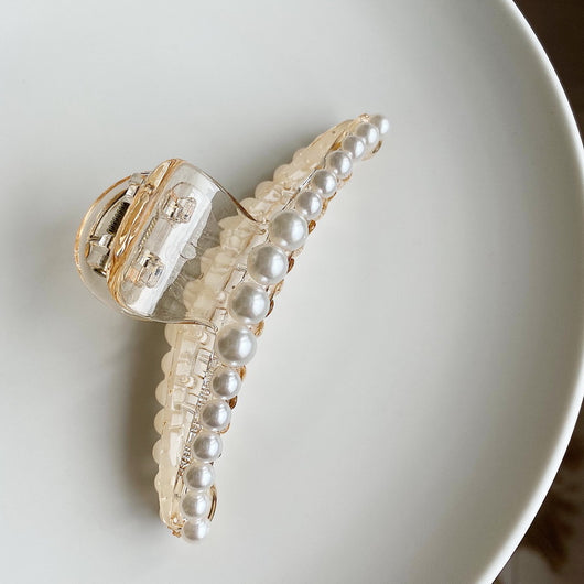 Clear plastic hair claw clip adorned with a single row of white faux pearls and a gold-toned spring. - Image 10