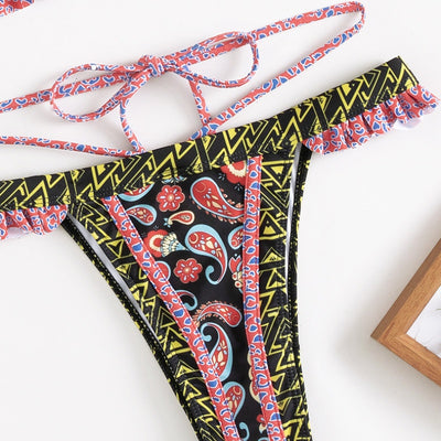 Teal bohemian print bikini with halter neck top, ruffled edges, and high-cut bottom with side straps. - Image 10