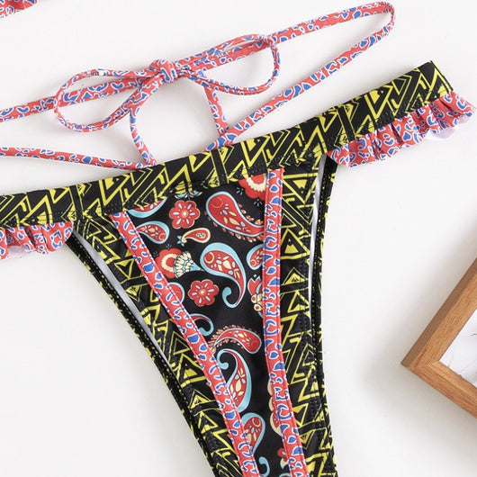 Teal bohemian print bikini with halter neck top, ruffled edges, and high-cut bottom with side straps. - Image 10