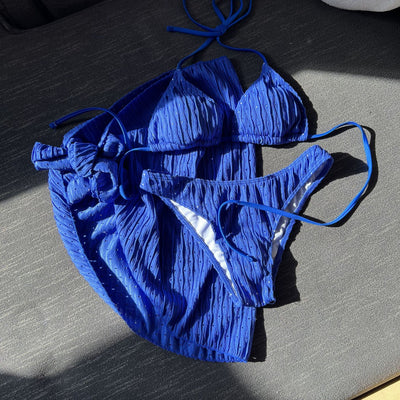 White textured bikini with ruched triangle top, high-cut bottom, and matching sarong with a large bow. - Image 12