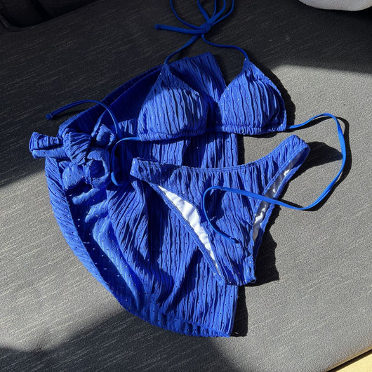 White textured bikini with ruched triangle top, high-cut bottom, and matching sarong with a large bow. - Image 12